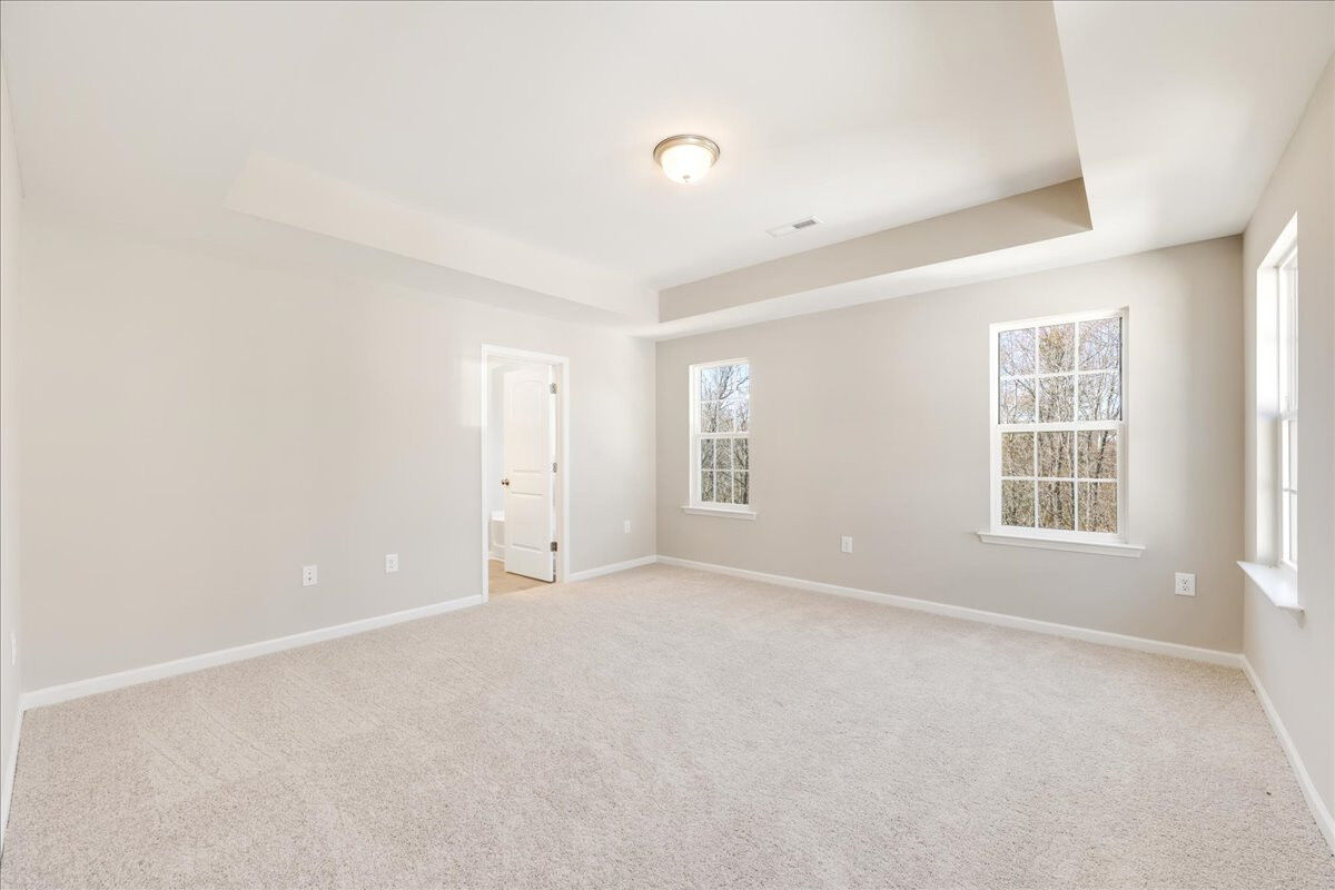 https://assets.windsorhomes.us/img/BCR_lot1_Cameron_elvB_1955_Kippen_Drive_primary_bedroom.jpg