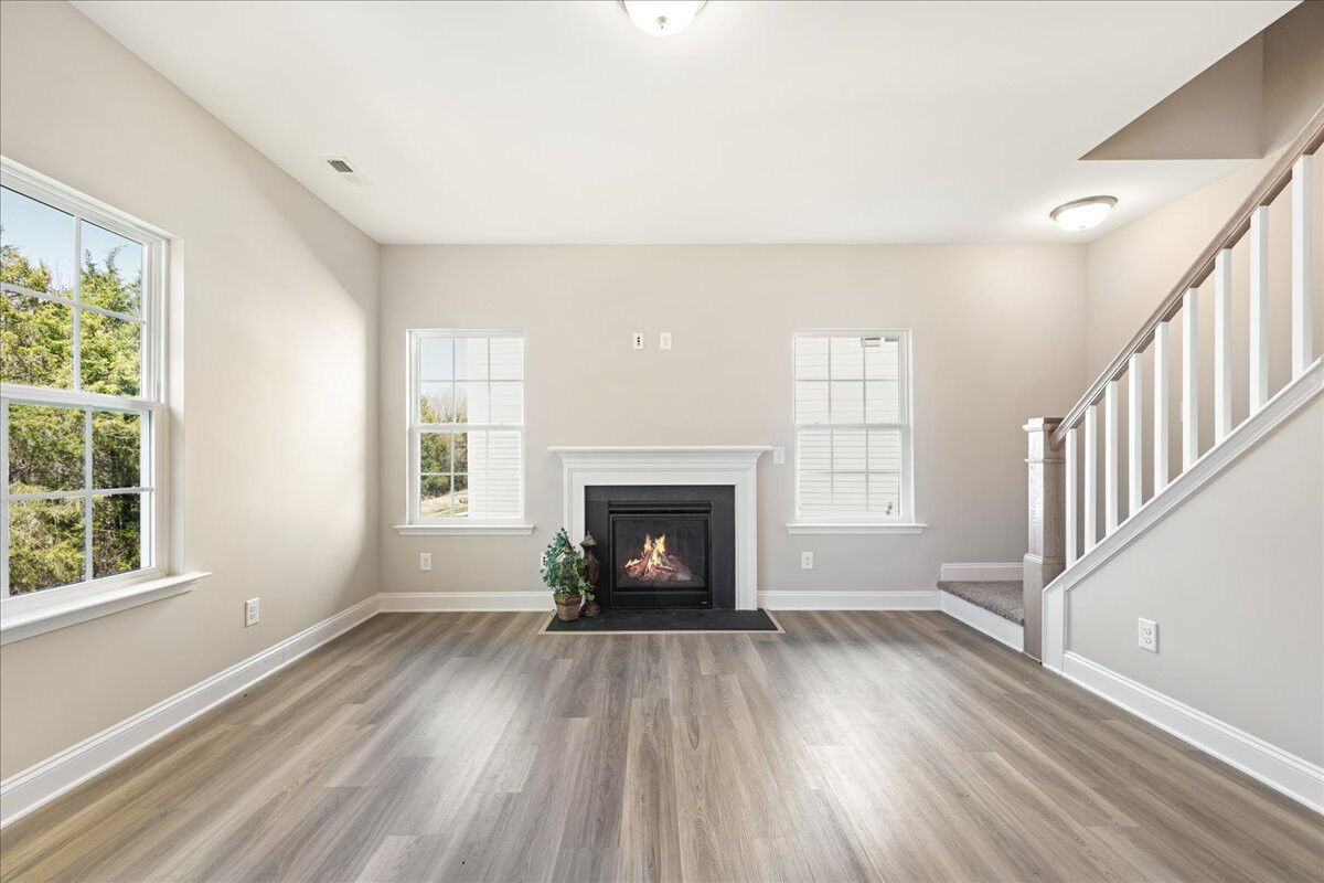 https://assets.windsorhomes.us/img/BCR_lot4_Stoddard_elvF_1949_Kippen_Drive_great_Room.jpg