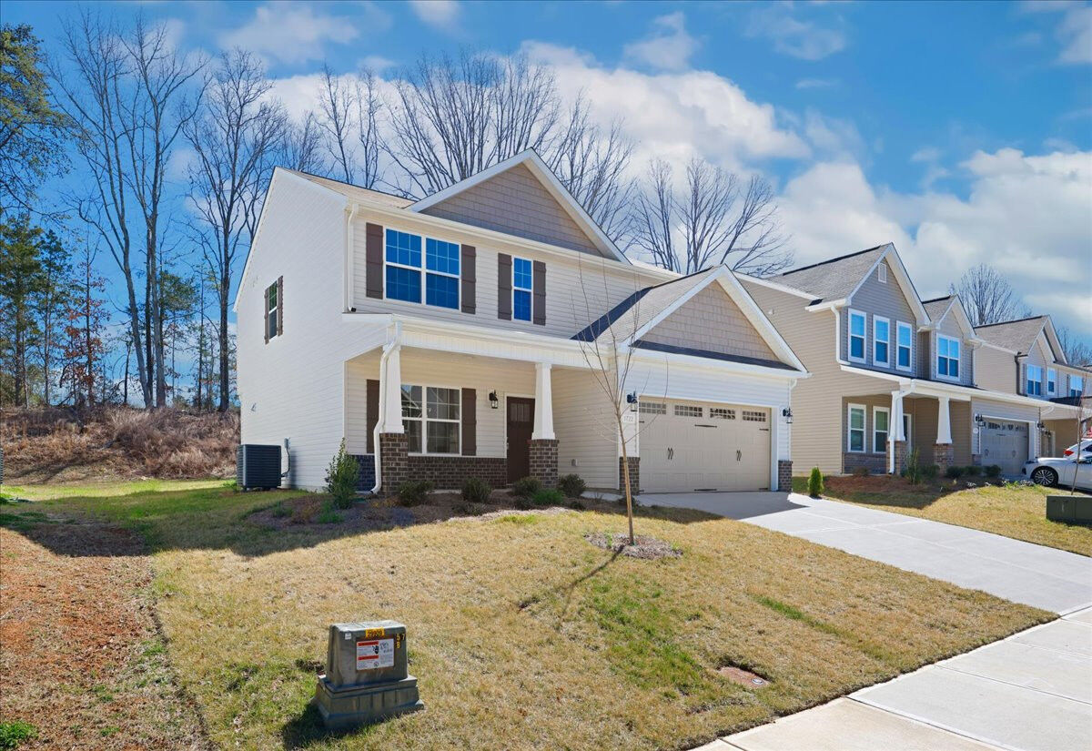 https://assets.windsorhomes.us/img/BCR_lot56_Stoddard_elvE_1722_Springbank_Drive_exterior_side.jpg