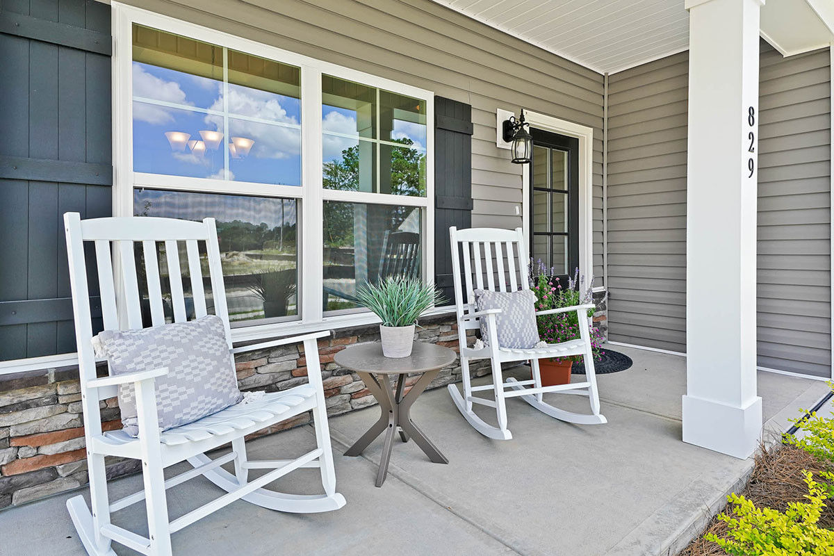 https://assets.windsorhomes.us/img/BMW_lot_64_Bailey_A_829_Red_Sky_Drive_NE_front_porch.jpg