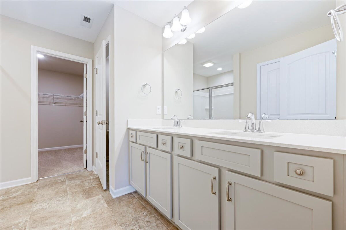 https://assets.windsorhomes.us/img/CCK_lot81_Cameron_elvA_4118_Stallion_street_primary_bath.jpg