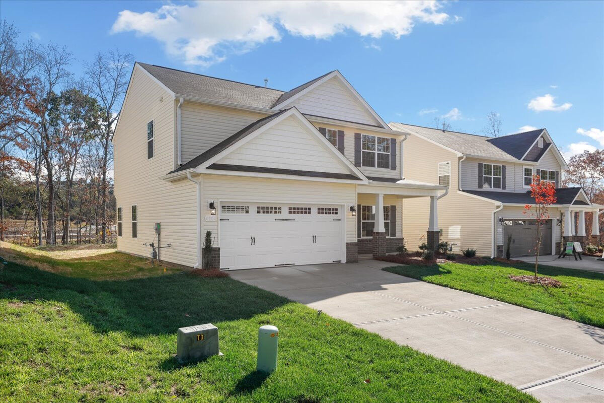 https://assets.windsorhomes.us/img/CCK_lot86_Stoddard_E_4204_Canter_Creek_Lane_exterior_side.jpg