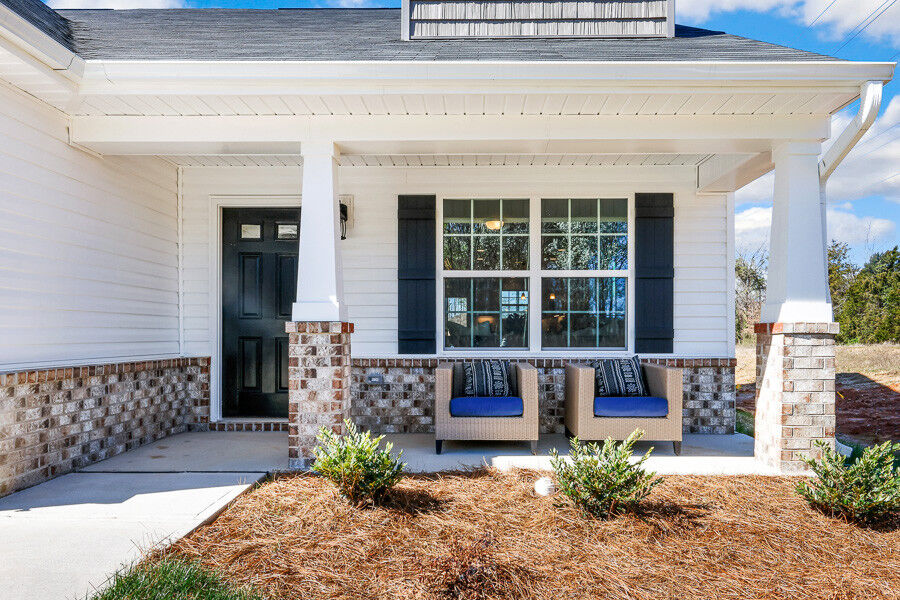 https://assets.windsorhomes.us/img/Indiana_A_VSC_lot1_4003_Straw_Hat_rd_exterior_close_front_porch.jpg