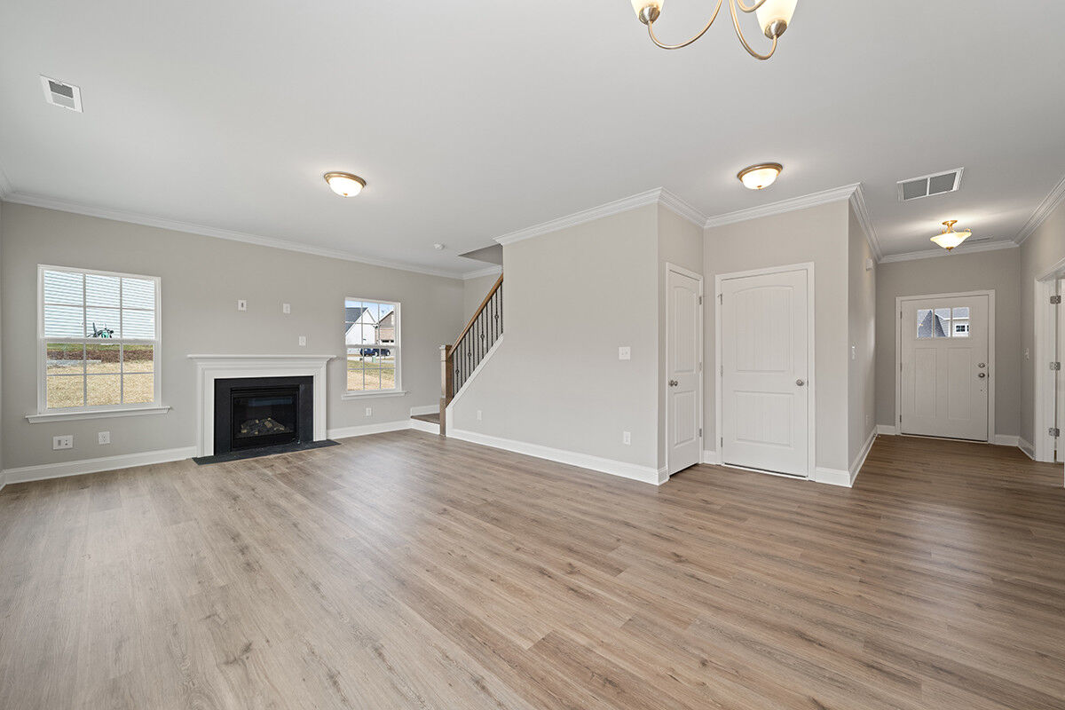 https://assets.windsorhomes.us/img/RP_lot64_Stoddard_elvF_4482_Olivine_Ln_great_room.jpg