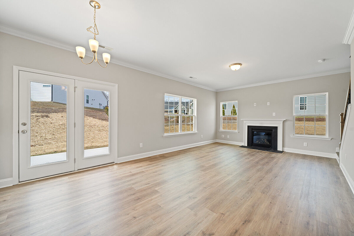 https://assets.windsorhomes.us/img/RP_lot64_Stoddard_elvF_4482_Olivine_Ln_great_room_3.jpg