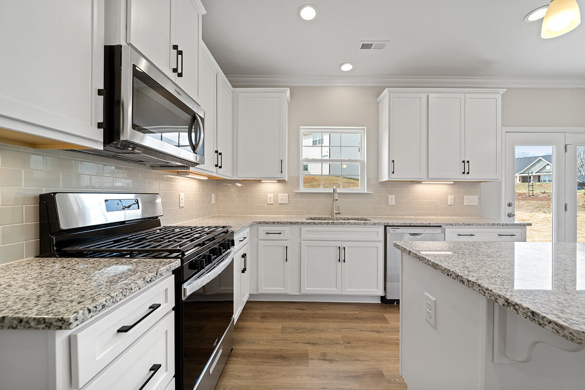 https://assets.windsorhomes.us/img/RP_lot64_Stoddard_elvF_4482_Olivine_Ln_kitchen_4.jpg
