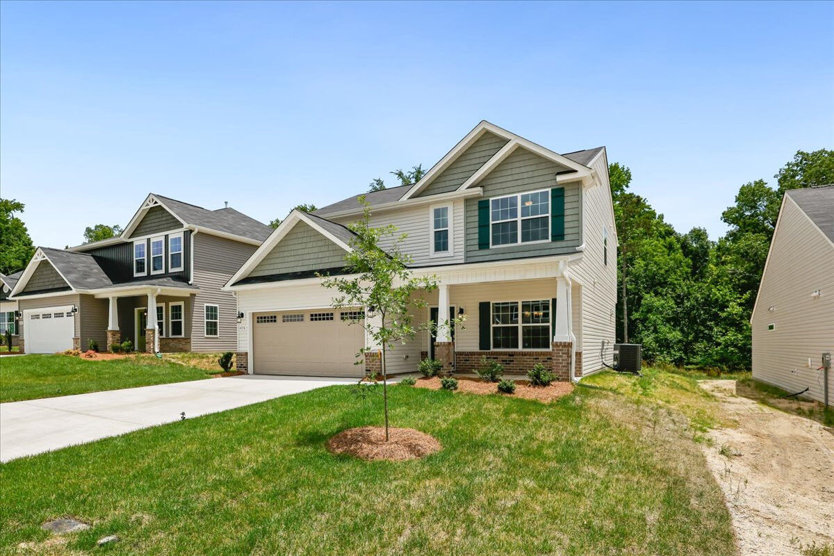 https://assets.windsorhomes.us/img/Stoddard_F_CCK_lot89_4216_Canter_Creek_Lane_exterior_side.jpg